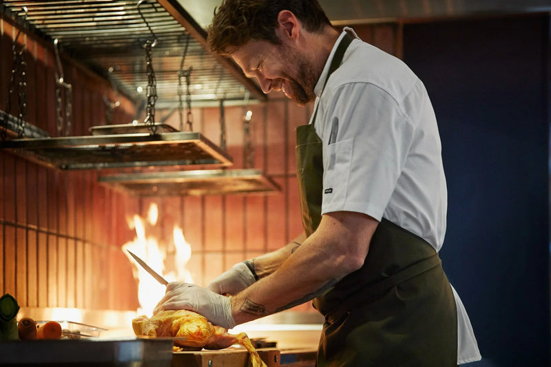 Professional chef practicing kitchen safety