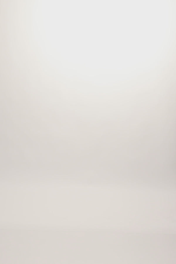 A stylish Portland Half Bistro Apron in durable crosshatch denim with contrast ties, perfect for chefs, baristas, and hospitality staff.